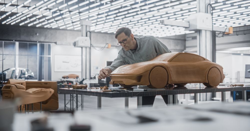 Automotive Artist Making Final Strokes on His Latest Concept Car Creation.