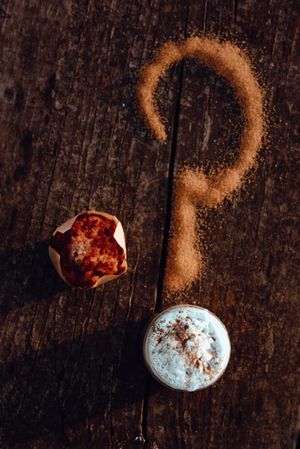 Cupcake near question mark and coffee