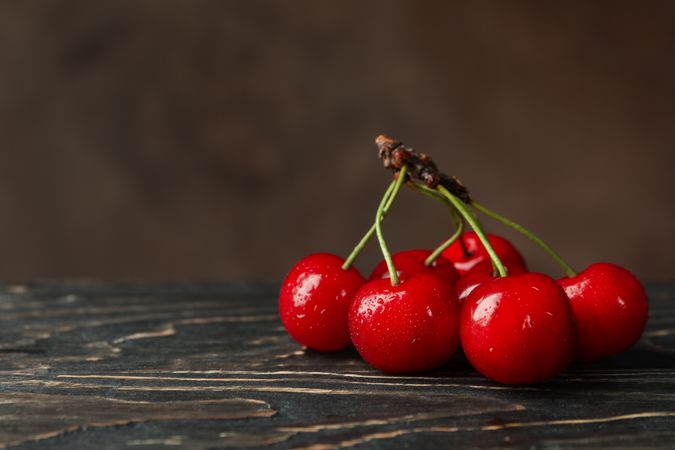 Fresh red cherry on wooden background, close up