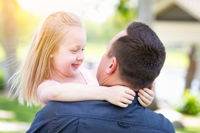 Young Father and Daughter Having Fun At The Park