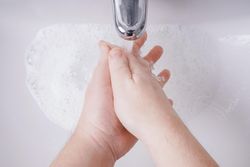 Person washing their hands