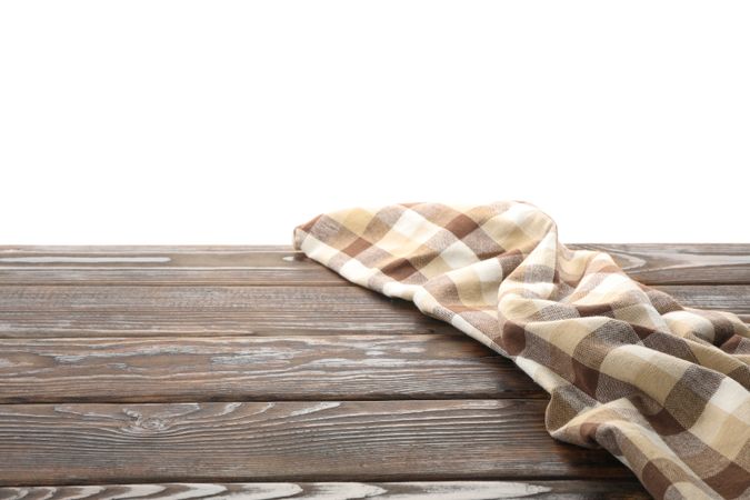 Fabric napkin on table against plain background, space for text