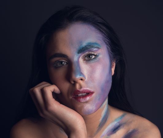 Young woman with painting face
