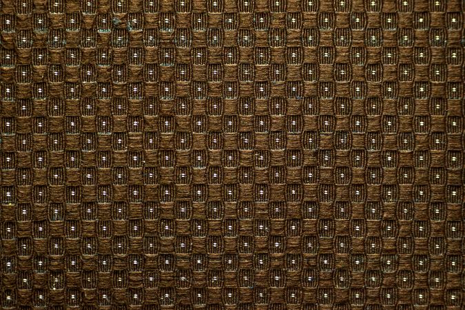 Texture background of brown cloth sofa in a pattern