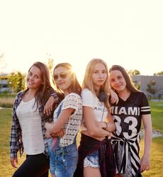 Group of female teenagers posing together in the sun