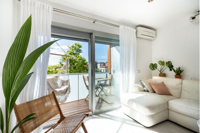 Interior of spacious living room with balcony