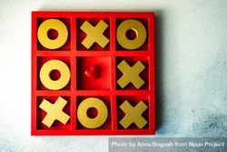 St. Valentine day card concept with small heart in center of tic-tac-toe game 4BaPxW