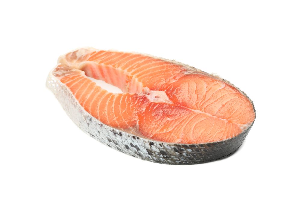 Fresh raw salmon meat isolated on light background