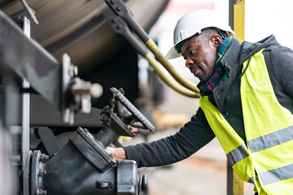 Man wearing safety helmet checking and inspecting gear train