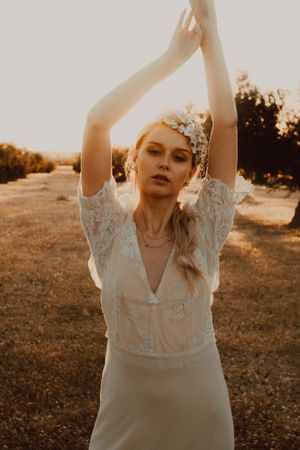 Woman in dress posing on nature