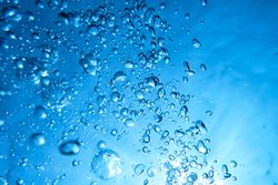 Plenty of air bubbles in blue water