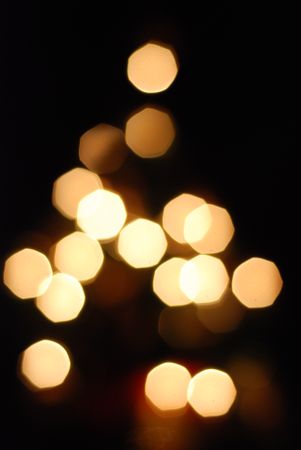 Golden lights in triangle formation with bokeh