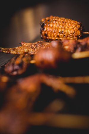 Tasty grilled skewers on table in cafe