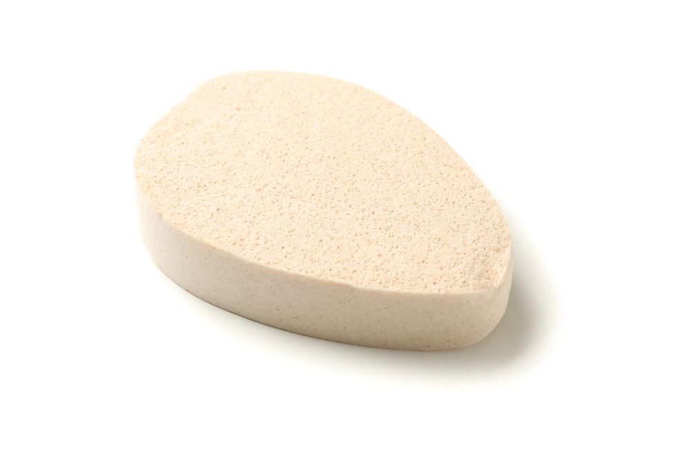 Light bath sponge isolated on plain background