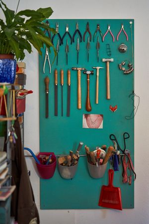 Set of various jewelry tools hanging on wall