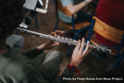 Top view of student playing the flute 5pV3jb