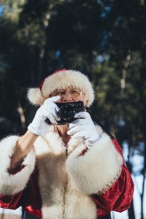 Happy Santa Claus with camera