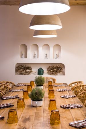 Served table with burning lamps above