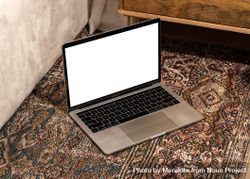 Laptop with blank screen for mockup on rug with pattern 5Xlvo5