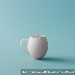 Egg shell coffee cup on pastel blue background 4Bqkk5