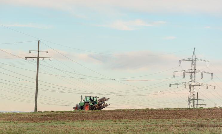 Tractor working the agricultural fields outside of Stuttgart city, Germany