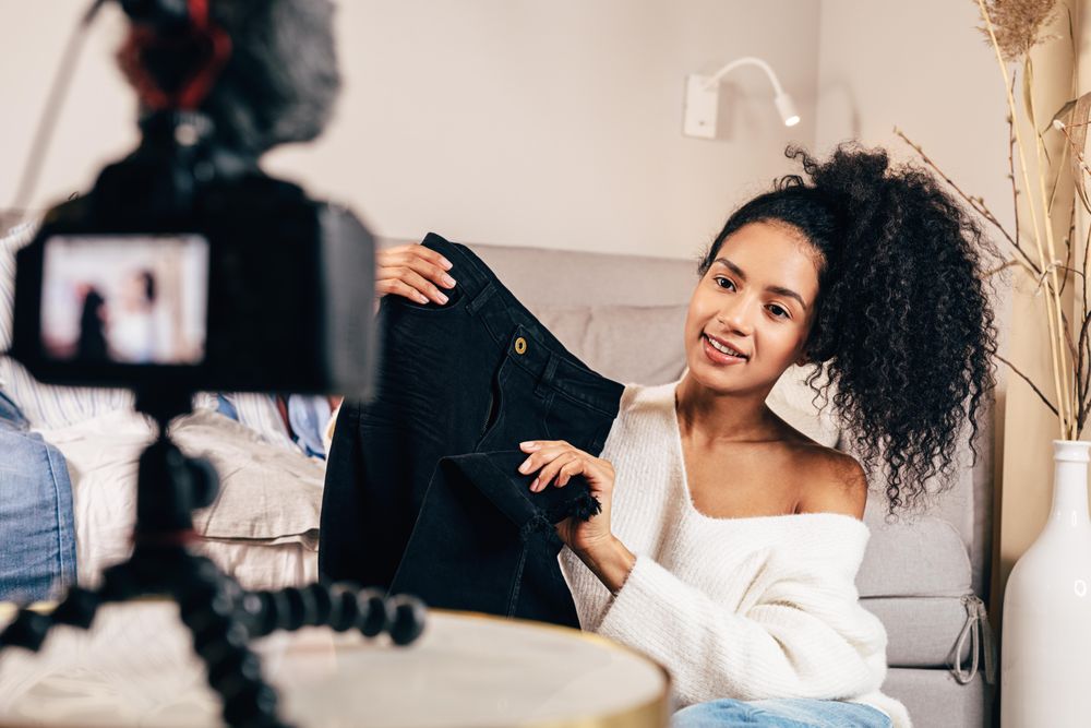 Trendy woman holding up skirt to camera