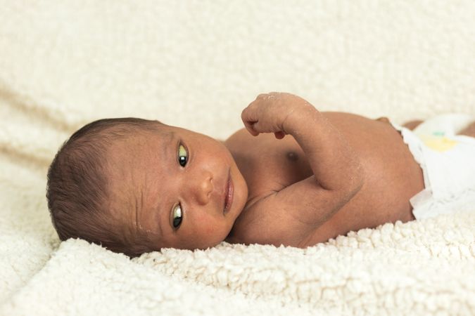 Newborn baby on soft blanket