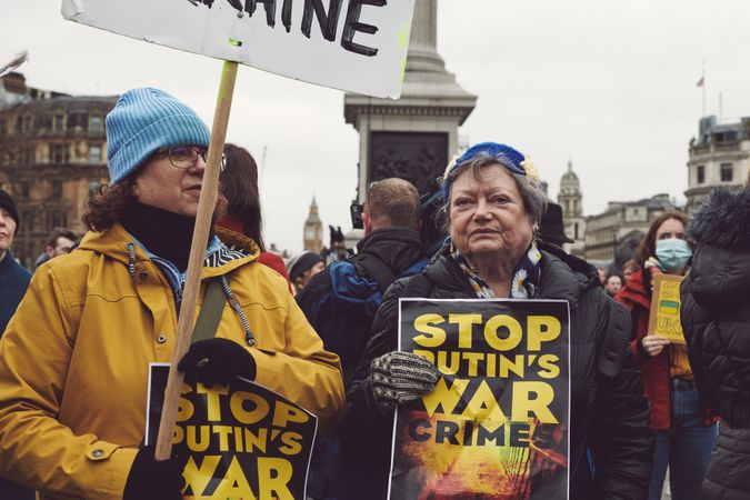 London, England, United Kingdom - March 5 2022: Two woman with “Stop Putin War Crimes” sign