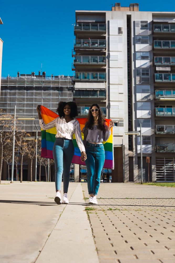Women couple with LGBT flag