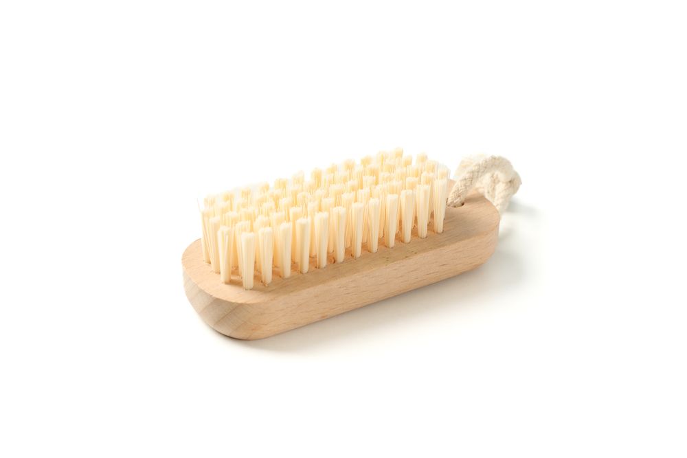 Wooden bath brush isolated on blank background