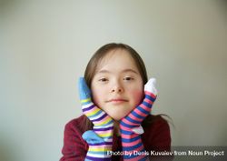 Silly girl playing with two different socks on her hands 5ldW75