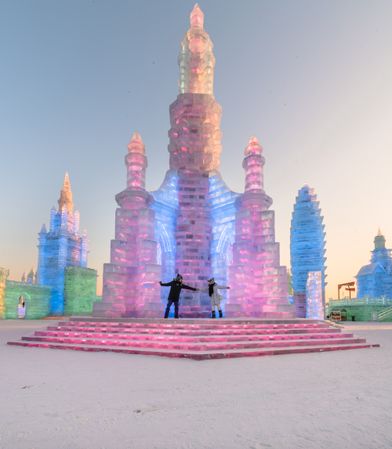 Anonymous couple dancing near ice castle