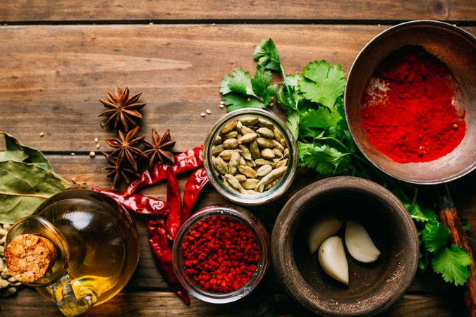 Spices and oil on table