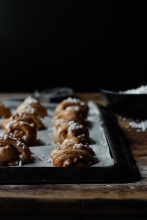 Sugar and cutter near cardamom buns