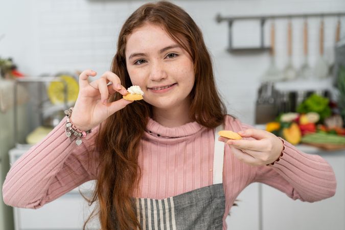 Portrait of girl in kitchen with cookies