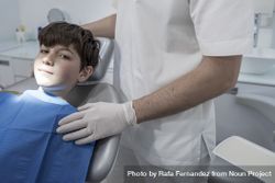 Portrait of teenager boy at the dentist 0Jmvpb