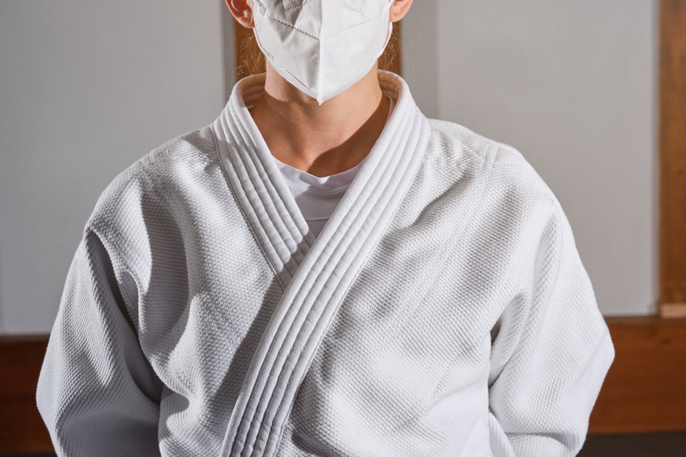 Woman in mask wearing kimono