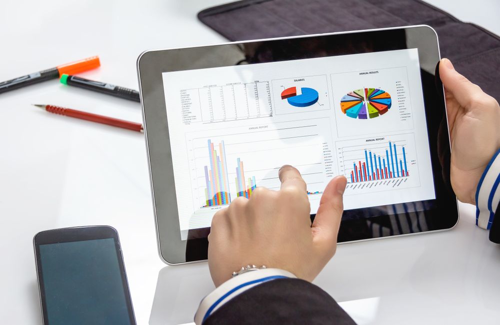 Businesswoman showing documents in digital tablet