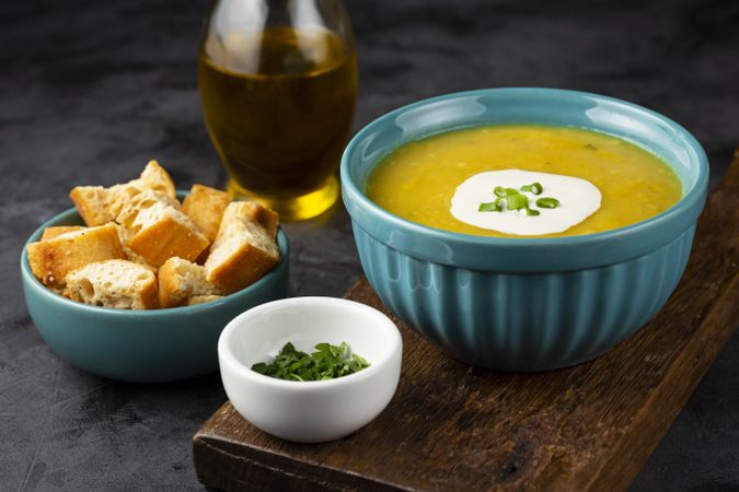 Bowl with pumpkin soup on the table.