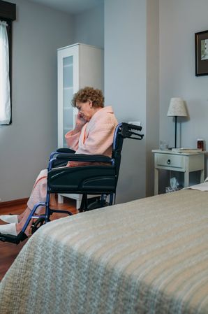 Woman in a wheelchair alone