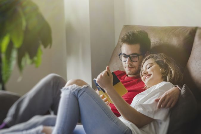 Dreamy couple with brochure