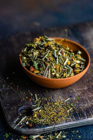 Bowl of green tea on cutting board