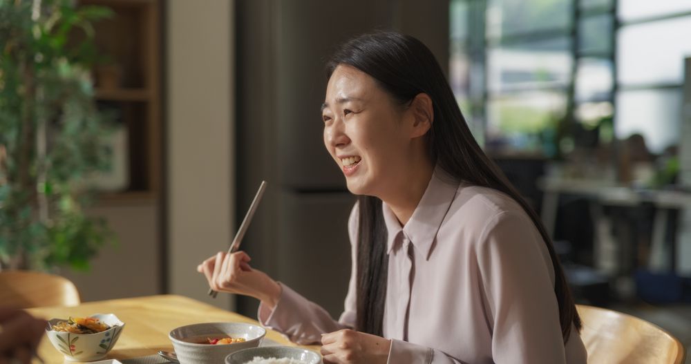 South Korean Young Couple Cooked Food at Home and Eating Together in the Kitchen.