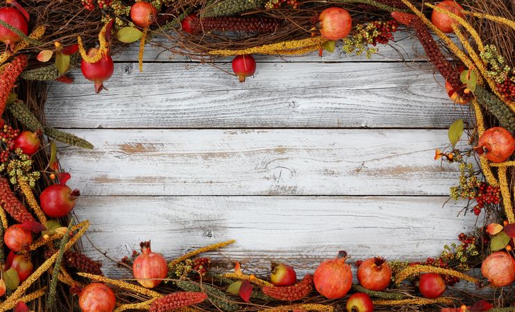 Autumn rectangle border of decor for the holidays on white rustic wood