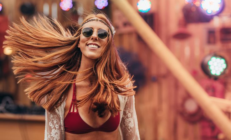 Attractive hippie woman at music festival outdoors