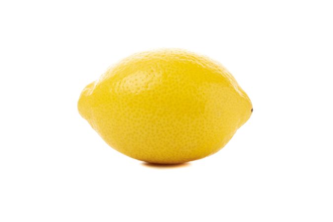 Fresh lemon isolated on light background. Ripe fruit