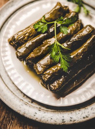 Plate of stuff grape leaves, vertical composition, close up