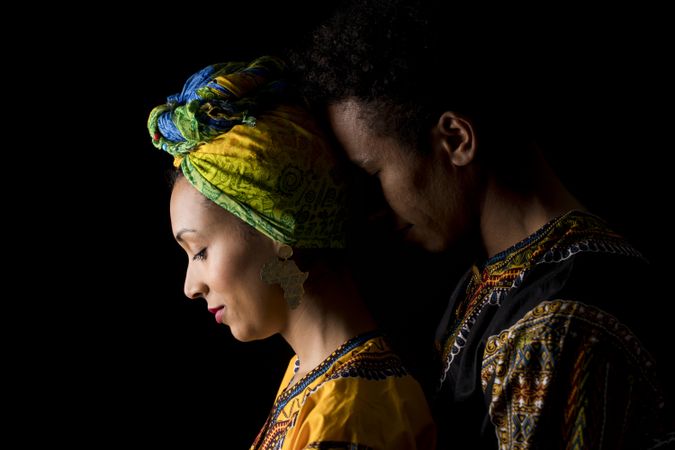 Couple of young Black people standing embracing