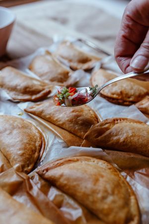 Baking tray with composed freshly baked pies patty