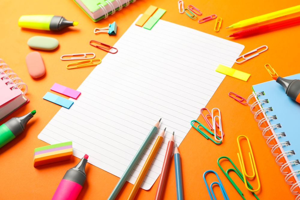 Composition with school supplies on color background, space for text